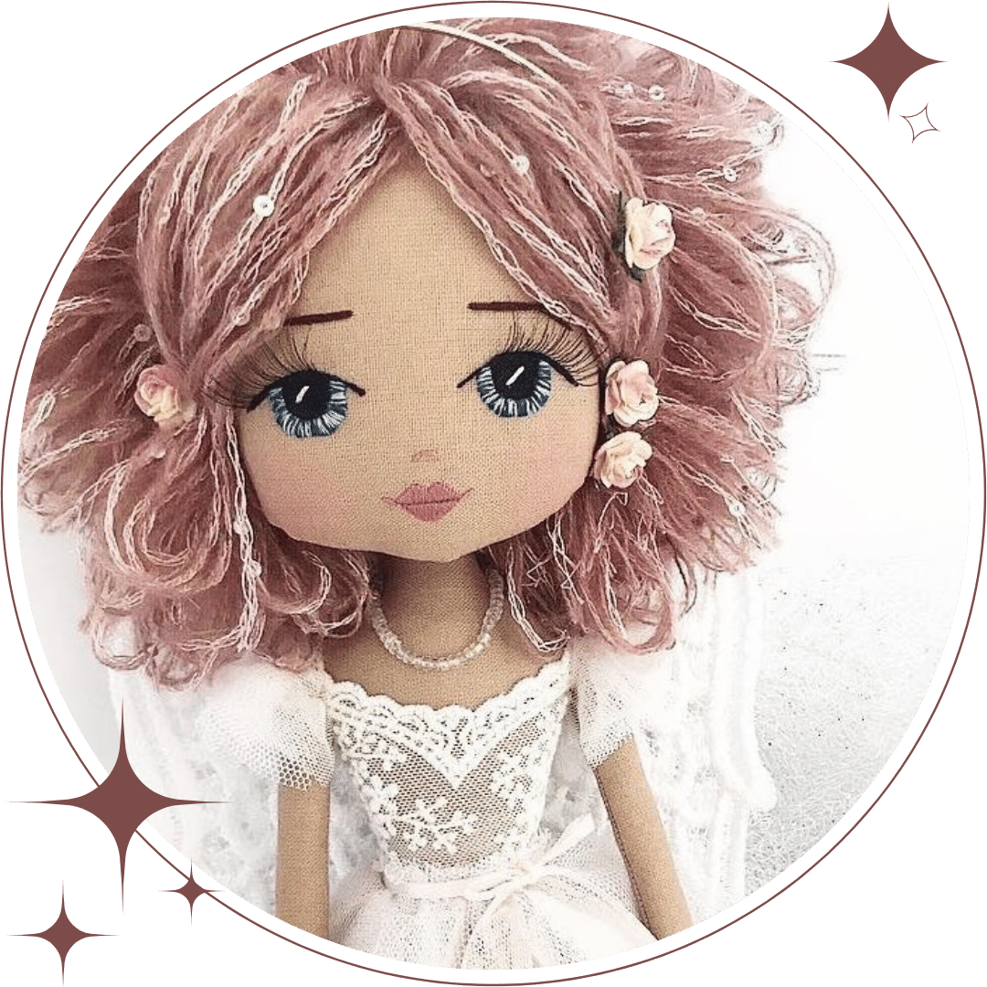Upper Dhali handmade angel doll with dusty pink sequin hair, hand embroidered face featuring blue eyes and a lace and tulle angel dress with lace wings