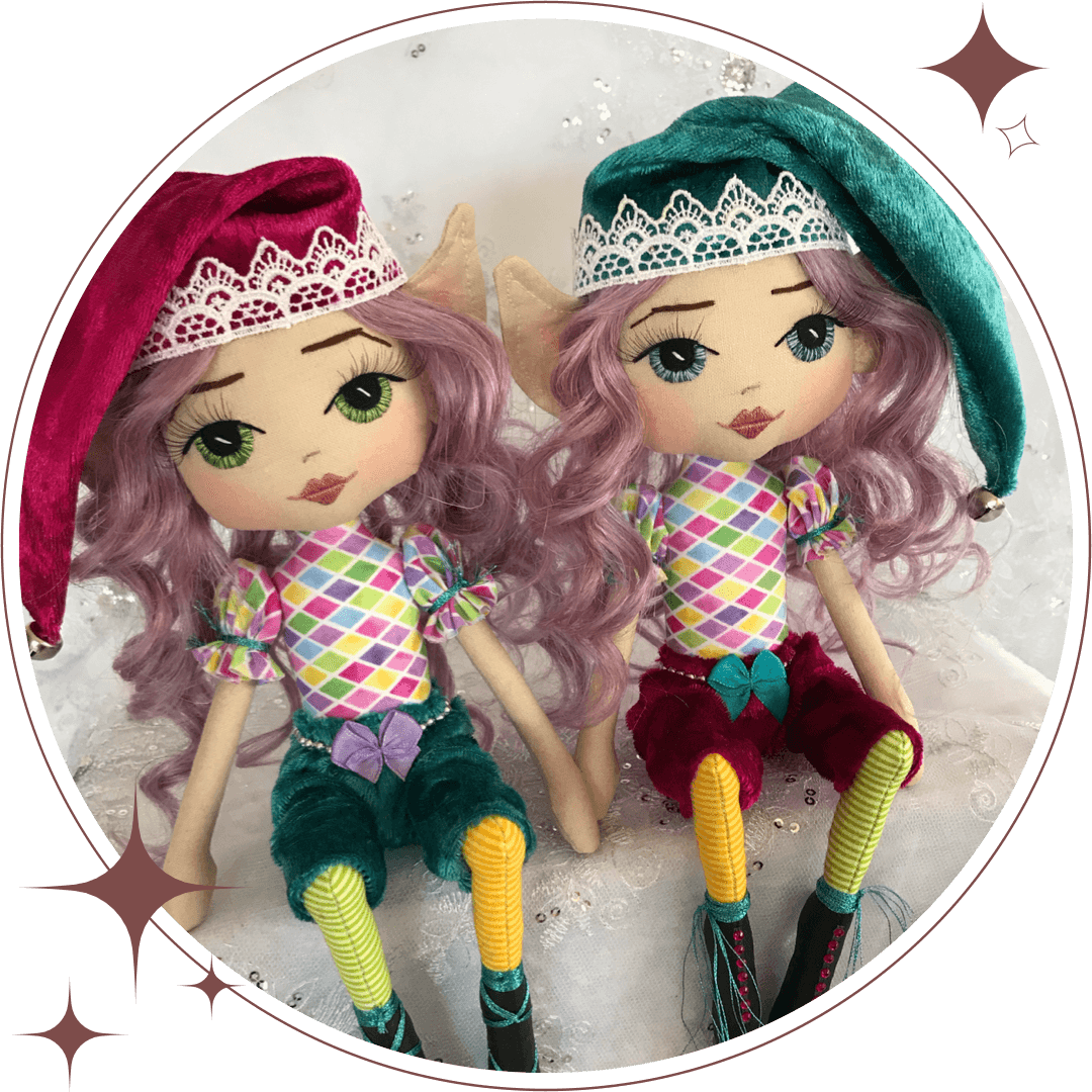two handmade elf dolls wearing jewel colours of teal, fushia, emerald pants & hat with purple hair