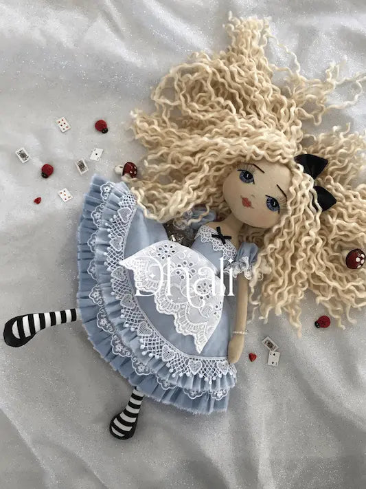 Alice in Wonderland doll, blue dress with ruffles and lace, lacey apron, blue ribbons, long blonde hair and black hair ribbon