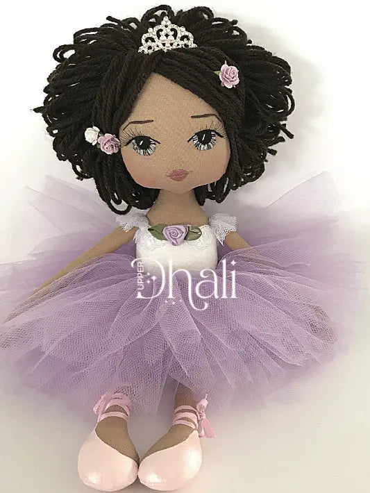 ballerina handmade doll wearing pink ballet slippers, lavender purple tutu skirt and white leotard wearing a silver tiara with purple rose detail in her hair