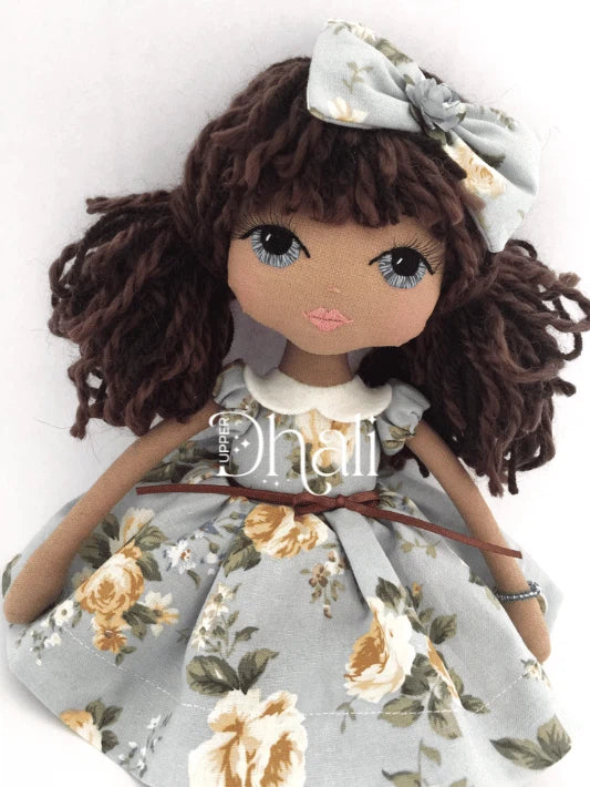 Fleur Lacey Lane Handmade Doll wearing a Lecien fabric blue and yellow floral 1950's inspired children's dress with bow in hair