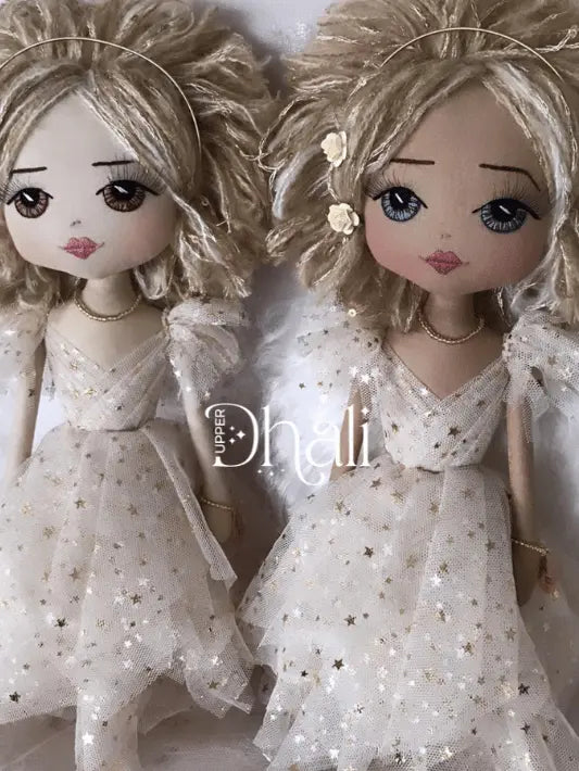 Two handmade angel dolls wearing a beautiful golden star flocked tulle dress with hand felted dreamy angel wings