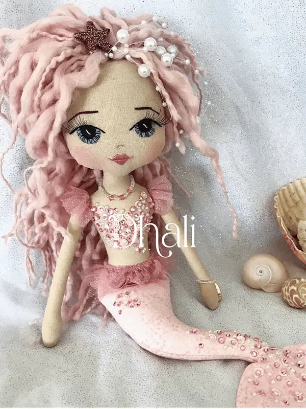 Pink mermaid doll with diamante and sequin detail, pink dreadlock mermaid hair and white pearl and pink star detail