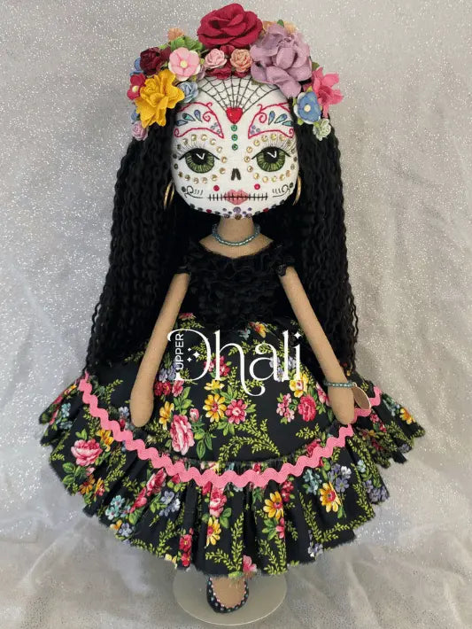 Sugar Skull doll with black and floral skirt, long black hair featuring bright colorful flower crown, hand embroidered face decorated with specialised hand stitching and diamante detail