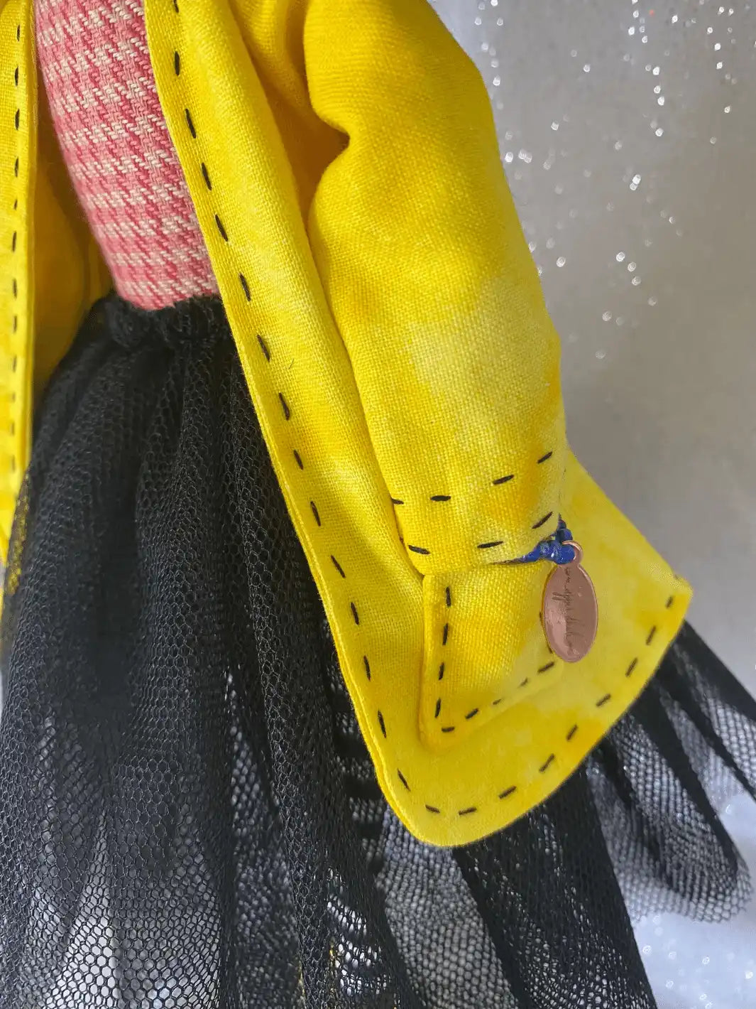 Coraline handmade doll yellow jacket stitching detail