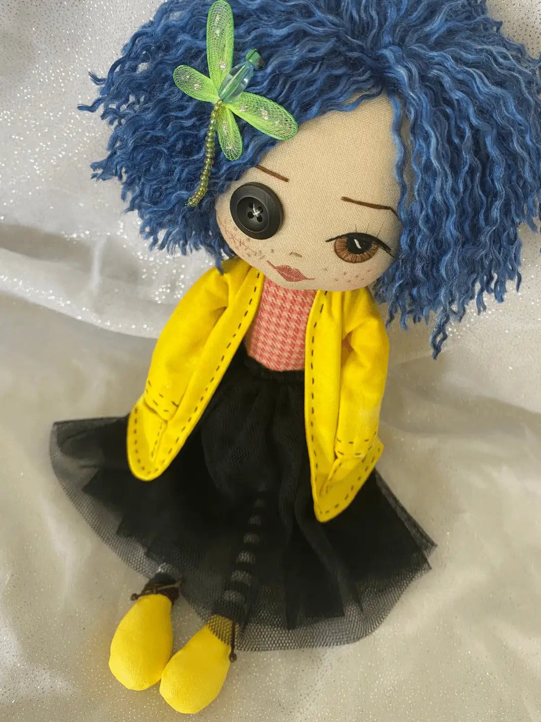 handmade doll with blue hair, black tulle skirt, yellow jacket, black and white stripe tights, brown eyes
