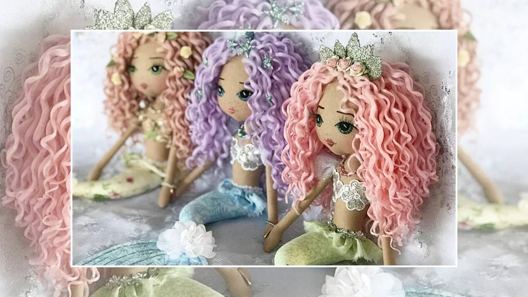 Trio of pastel rainbow mermaid dolls with curly hair and hand embroidered faces made by Upper Dhali