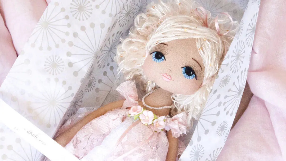 Keepsake Doll with blue eyes and pink lace dress in white gift box with ribbon
