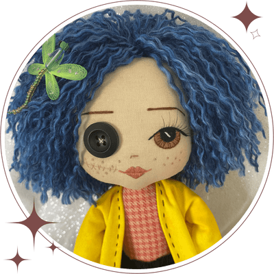 Handmade Coraline character doll with blue short hair, green dragonfly hairclip, hand embroidered face featuring one brown eye and one button eye. Wearing a pink & orange top and a black tutu skirt and yellow raincoat jacket with black stitching detail