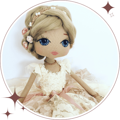 pretty girl doll dressed in a lace shabby chic dress with short blonde hair and rose and golden headband