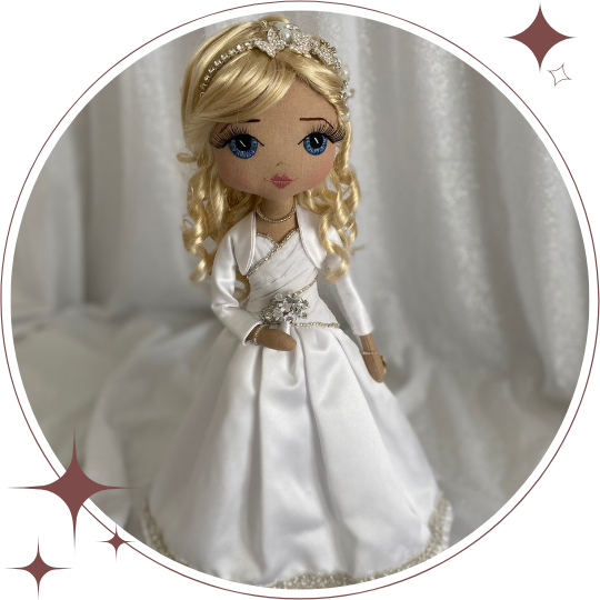 Doll in a white wedding dress with a tiara on a white background.