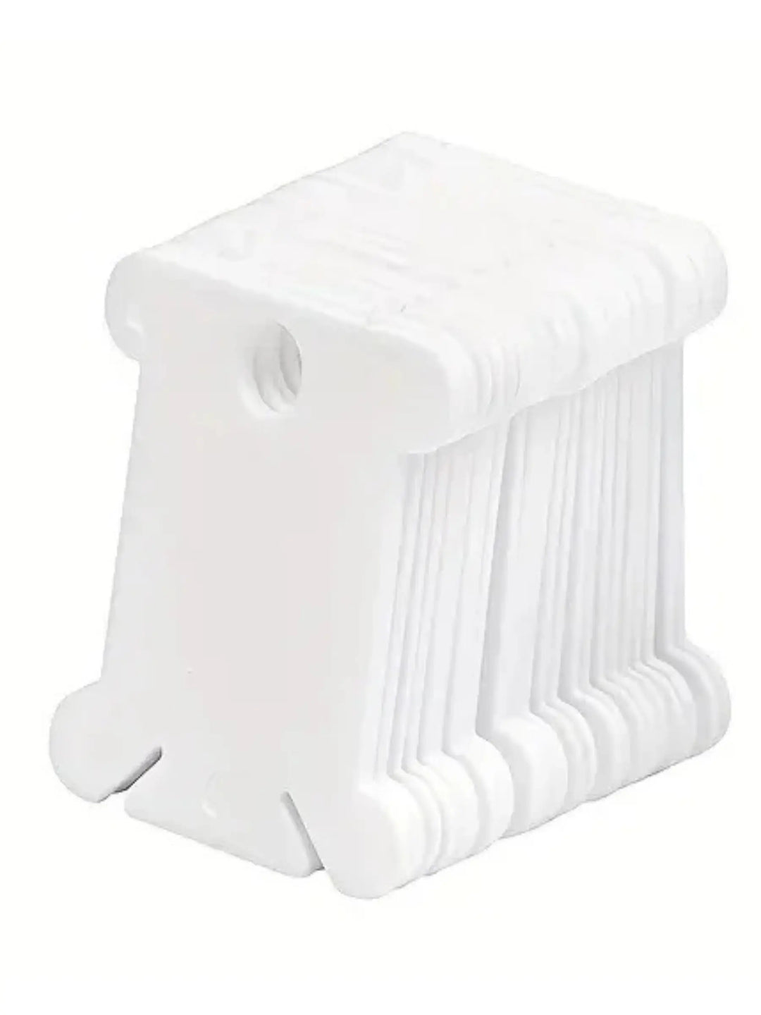 white plastic embroidery floss cards on white background