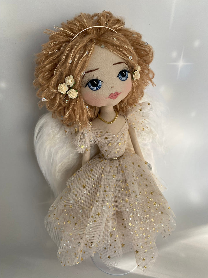Strawberry blond angel keepsake doll with blue hand embroidered eyes and a golden angel gown