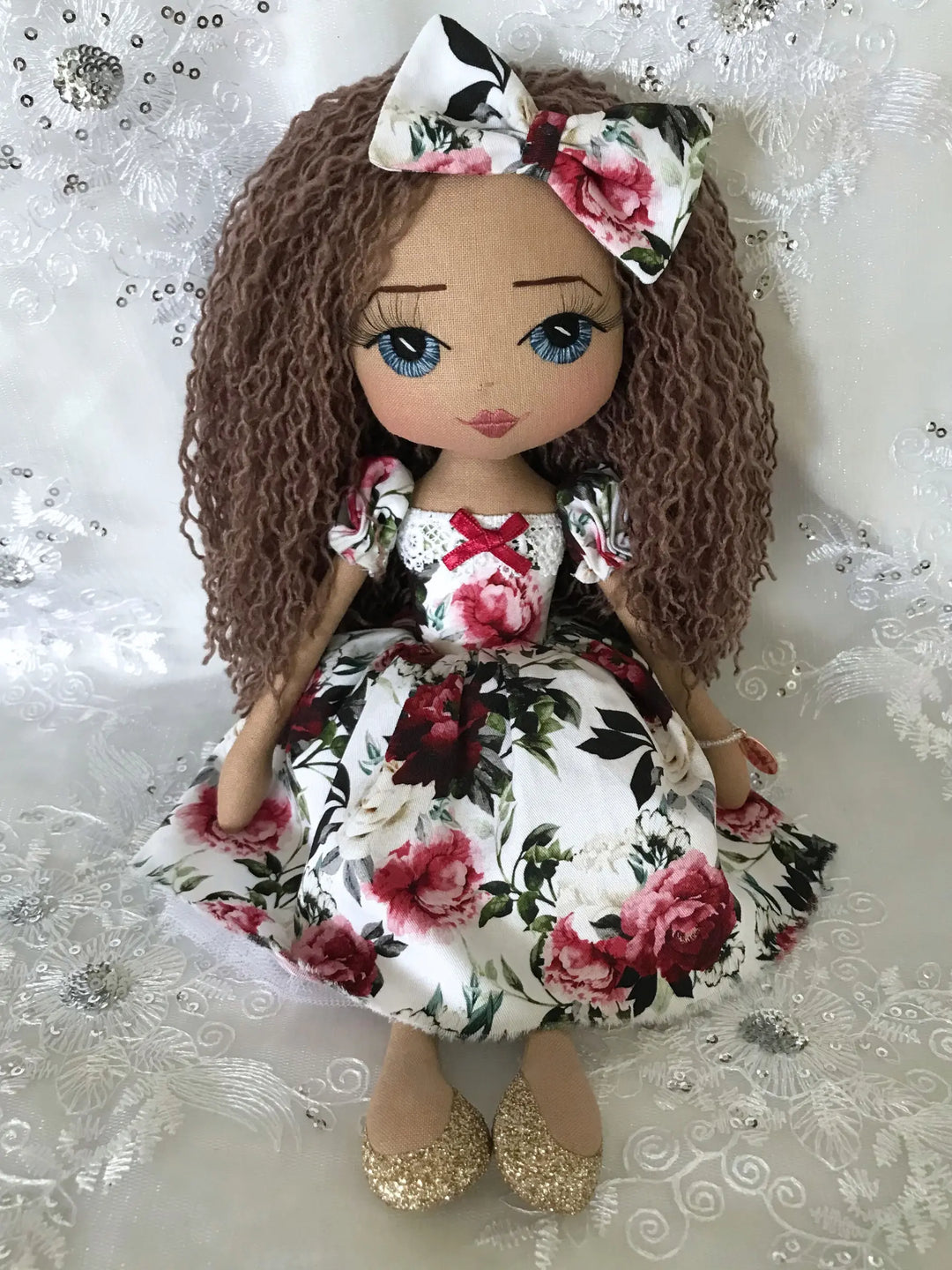 Doll with floral dress and headband made by Upper Dhali