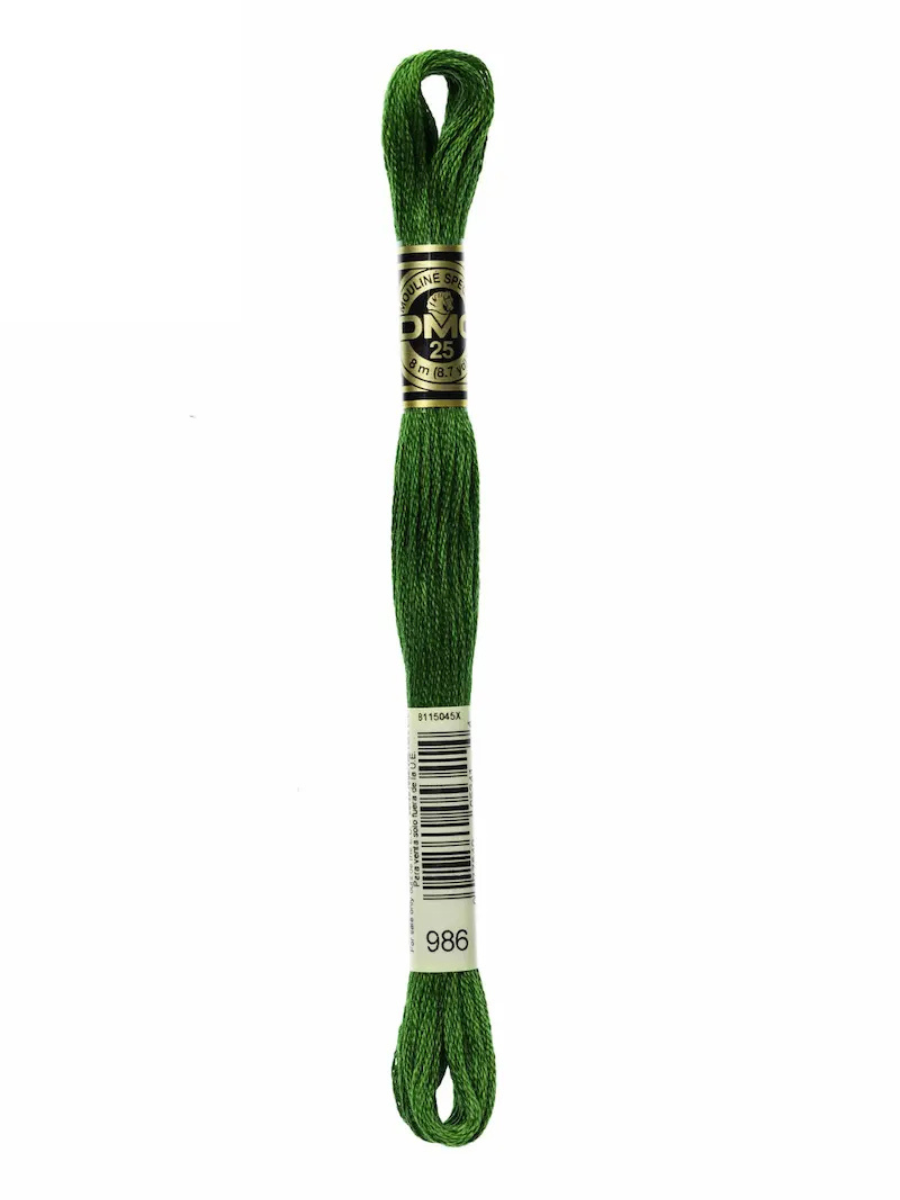 Dark Green embroidery floss spool on a white background