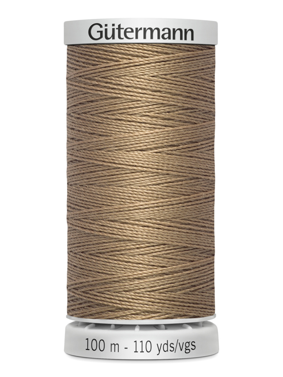 Spool of beige Gutermann thread 100m on a white background
