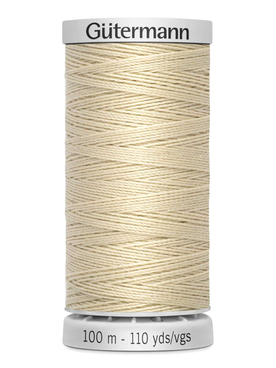 Spool of cream Gutermann thread 100m on a white background
