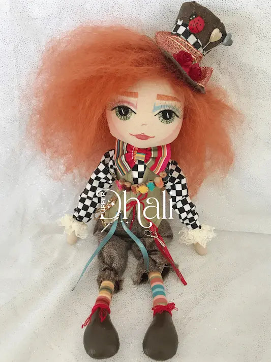 Mad Hatter handmade doll featuring crazy red hair, hand embroidered face with green eyes, top hat, green vest, blue and white checkered shirt, mini sewing scissors, ribbons and sewing thread spools
