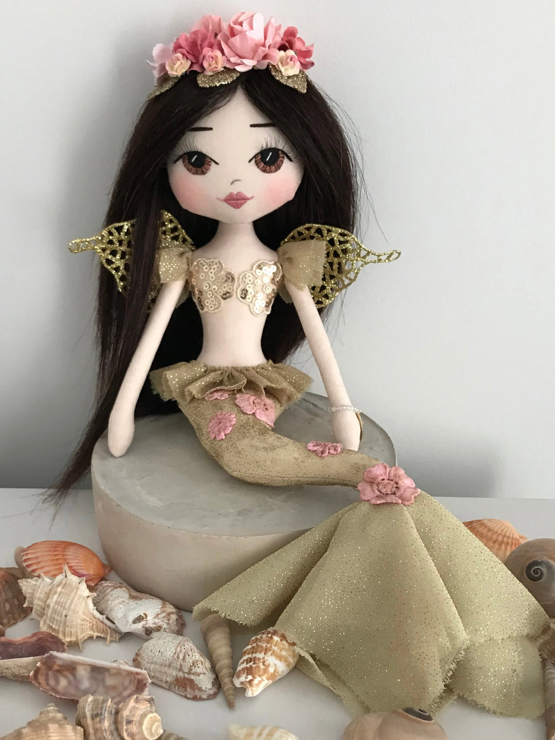 Gold mermaid with pink flowers and gold wings, long black hair & brown eyes, made by Upper Dhali