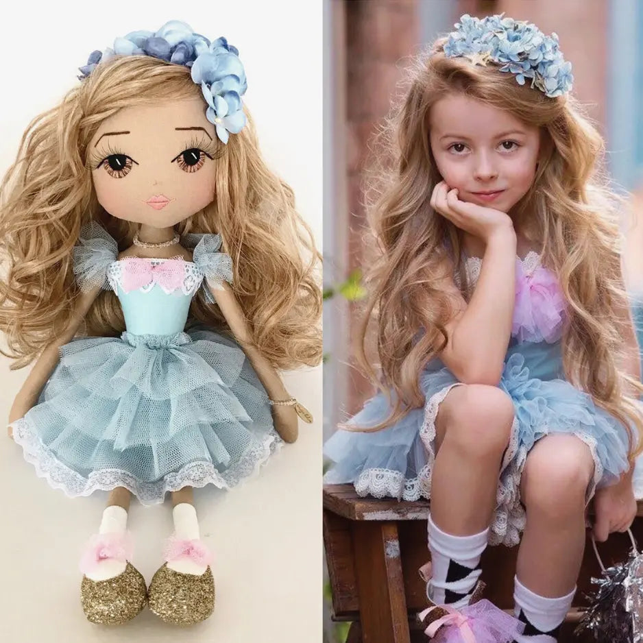 Side-by-side comparison of a doll and a girl wearing similar outfits with floral headbands.