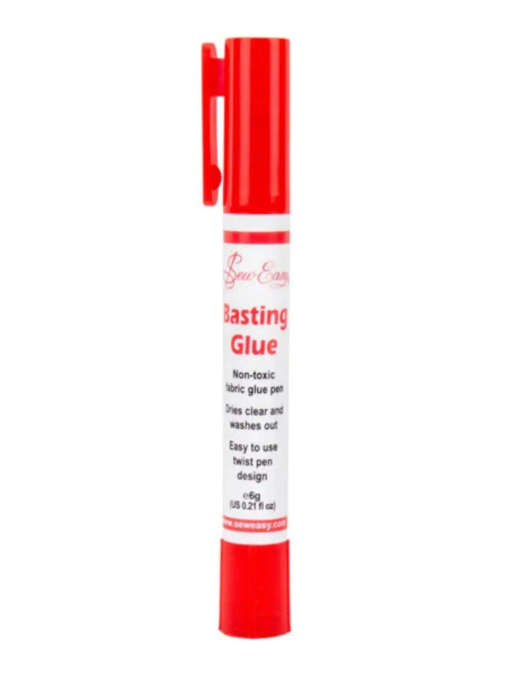 Fabric glue pen with red and white label on a white background