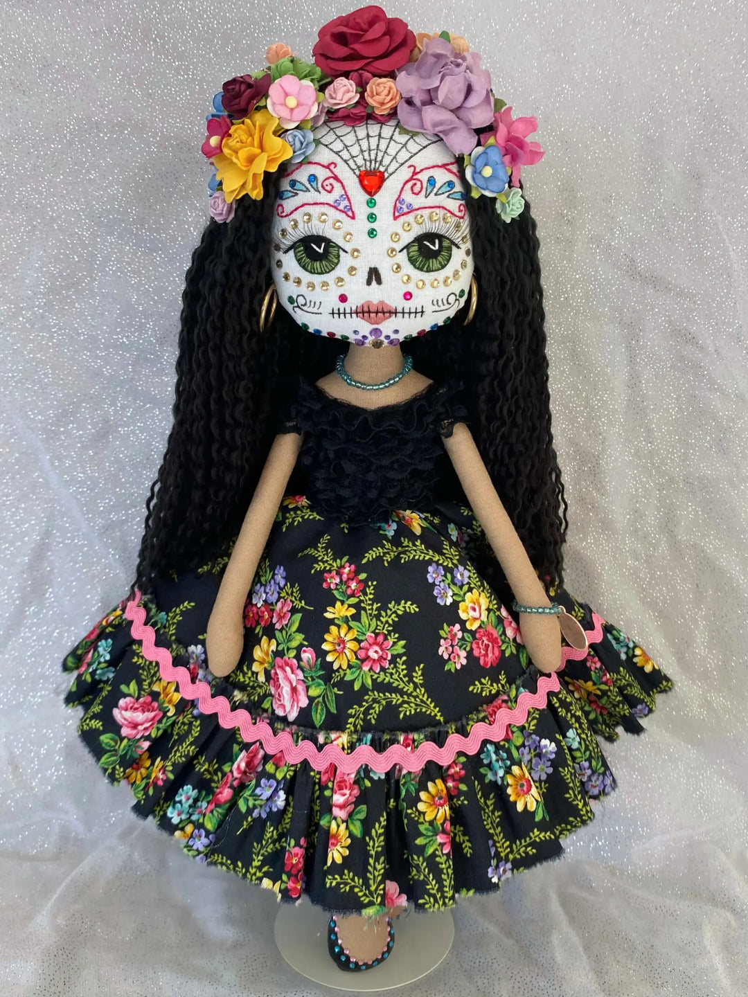 Sugar skull handmade doll wearing a colourful floral dress & headpiece made by Upper Dhali