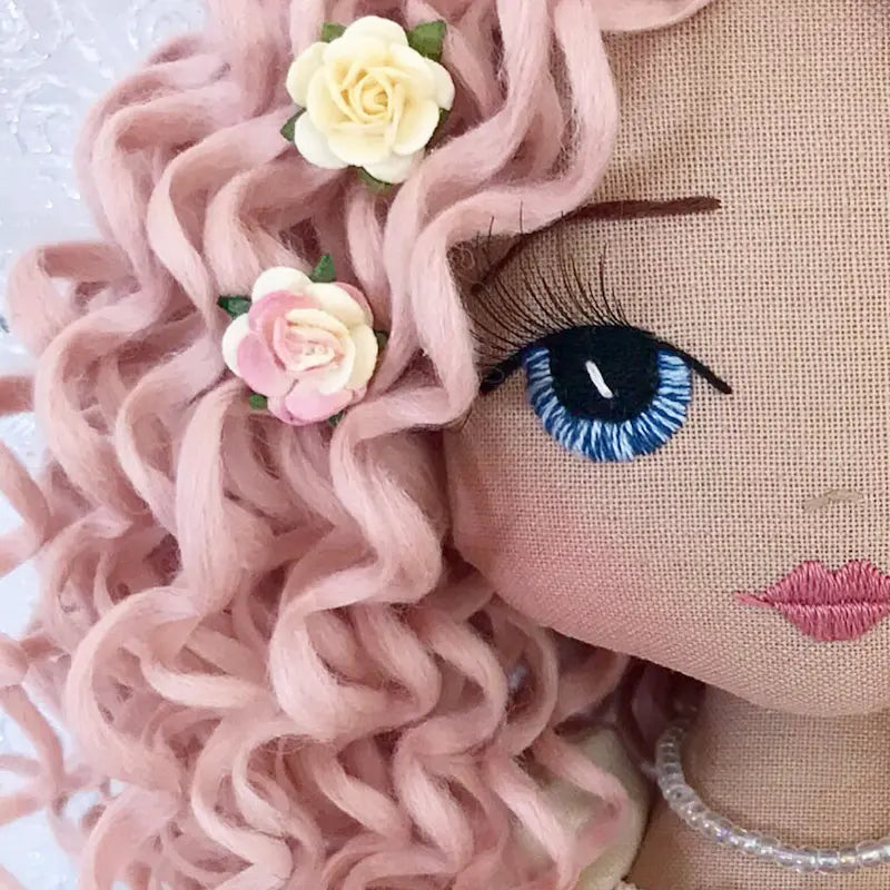 handmade doll with pink curly hair, blue eyes and 3d eyelashes