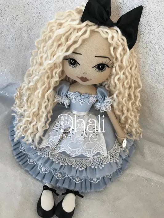 Alice in Wonderland Tea Party Handmade doll featuring a glorious blue dress with ruffles galore, brodie anglais apron and blue ribbon detail. Long blond hair, embroidered face and black hair ribbon