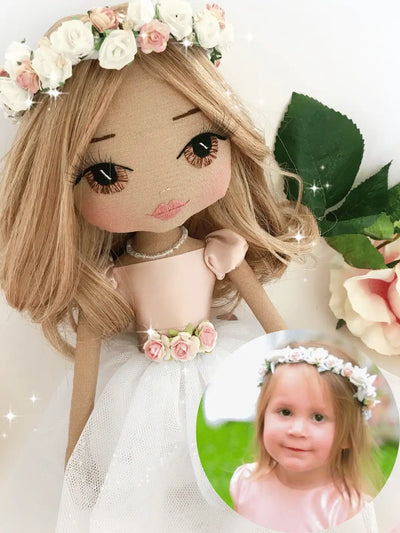 Upper Dhali personalised handmade doll with sparkling flower crown and pink and white christening dress with an image of the young child that she was custom made for at her christening