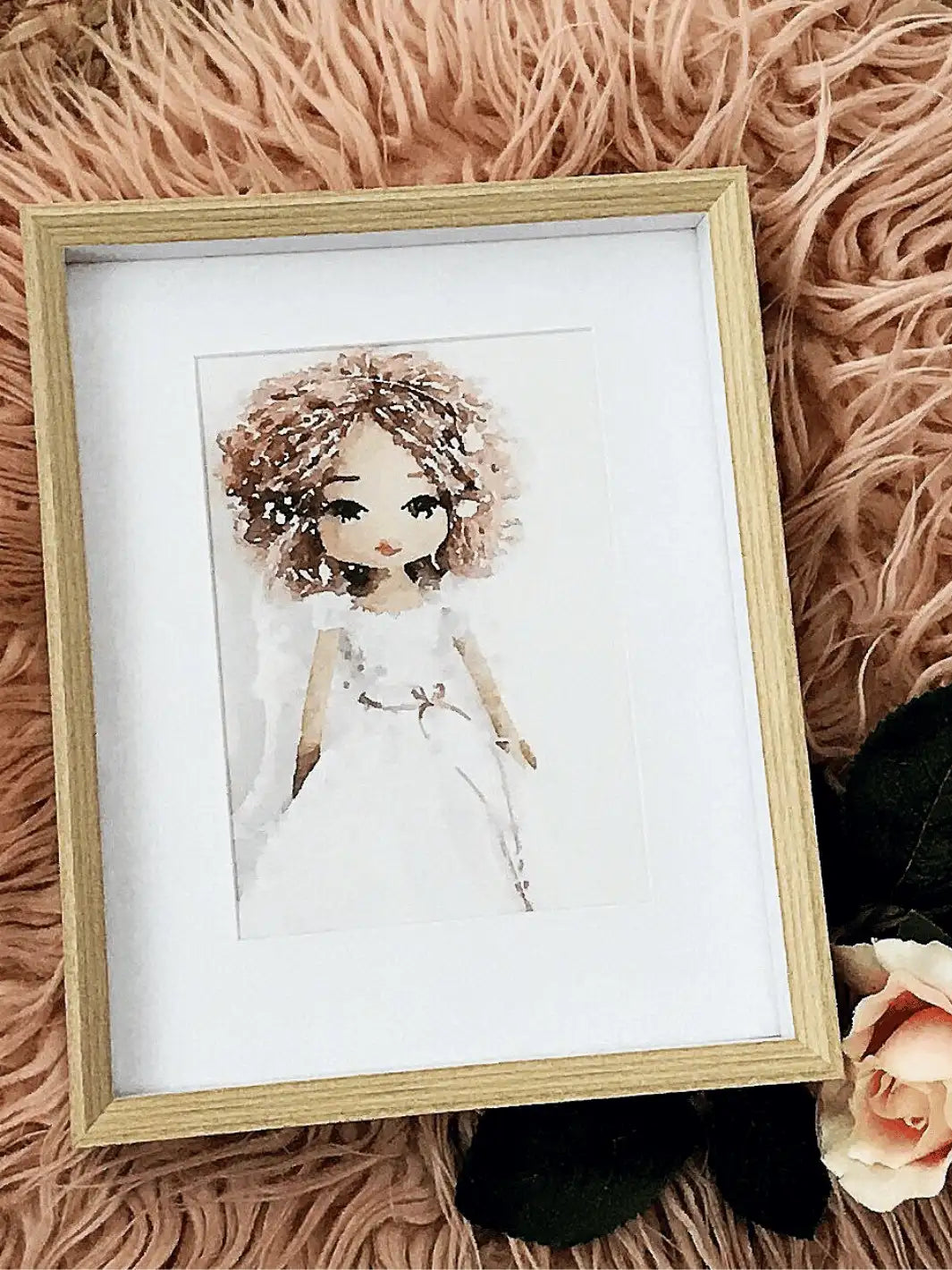 watercolour art print of a guardian angel handmade doll with dusty pink hair and pink ribbon around waist displayed in a white frame with timber edge